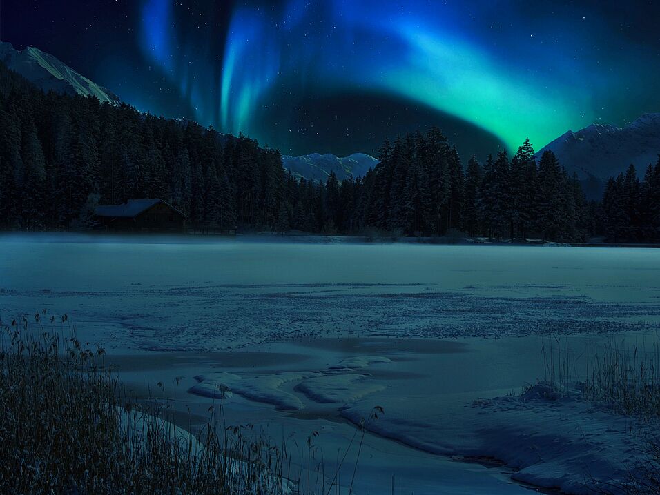 Polar lights above a frozen lake